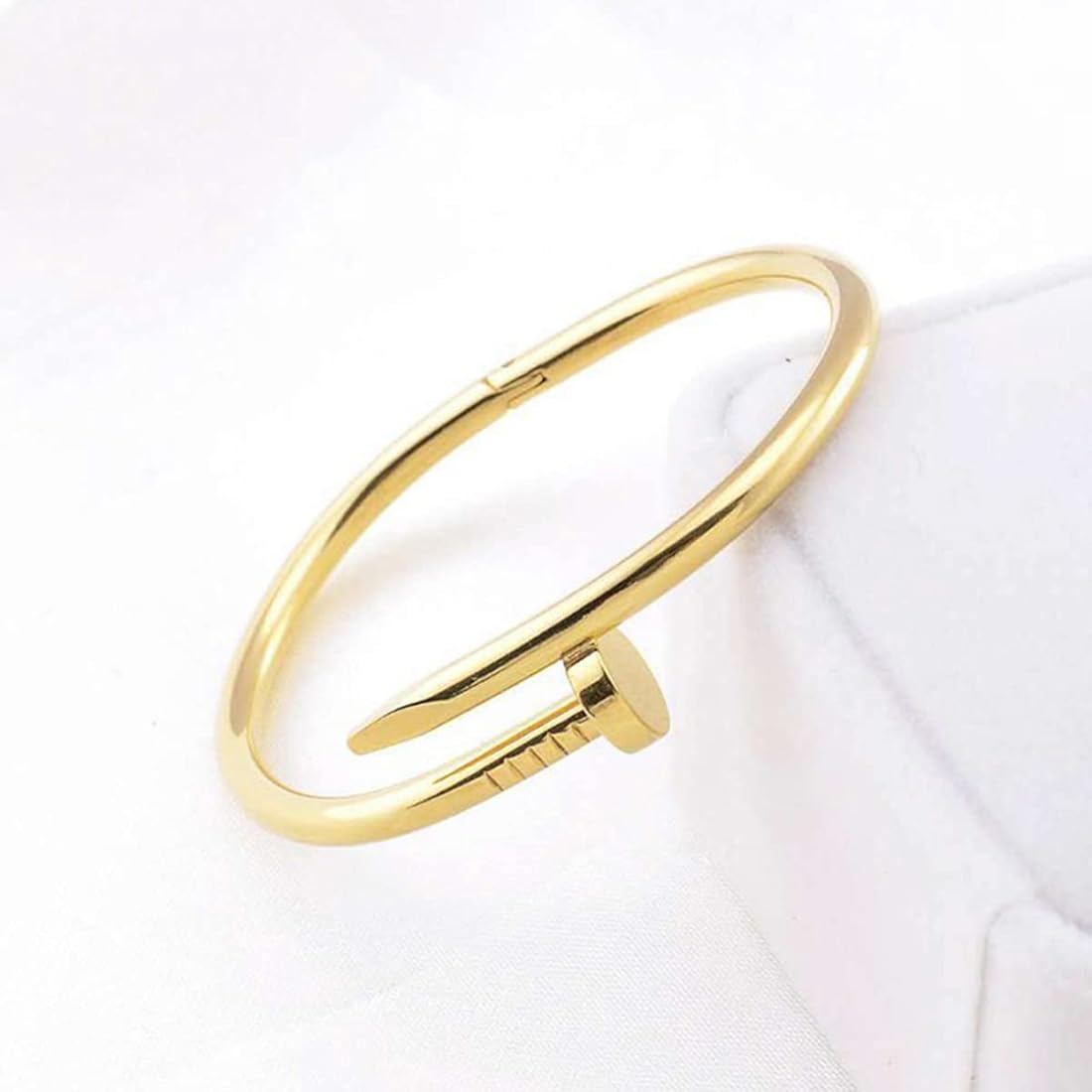 Nail Gold bracelet on a white background
