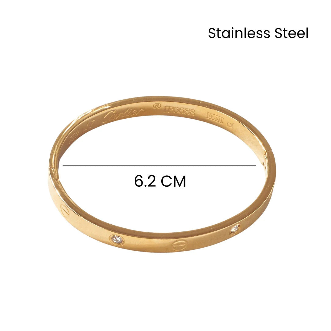 Gold bracelet with measurement label on a white background