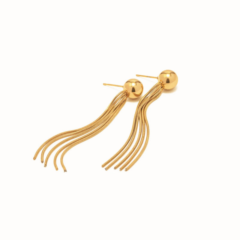 Gold tassel earrings on a white background