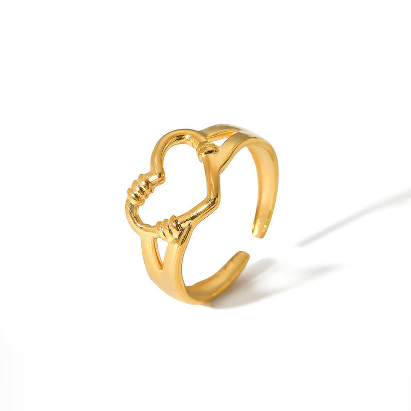 Gold ring with a unique design on a white background